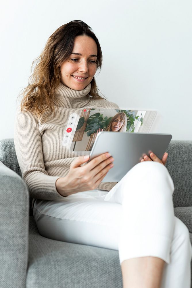 Woman using tablet for video call