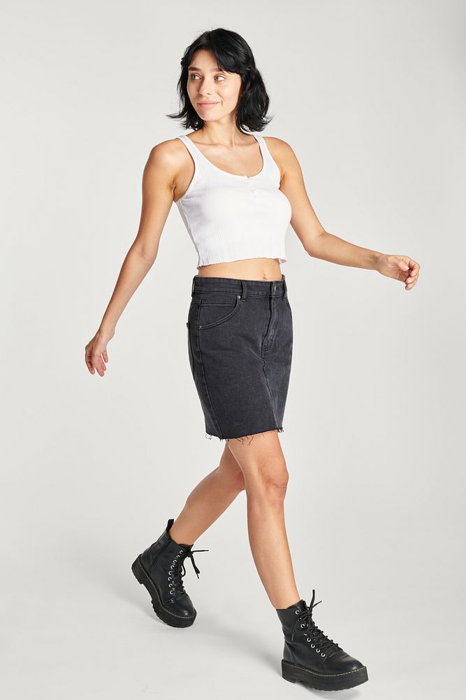 Women's white crop tank top and black combat boots outfit 
