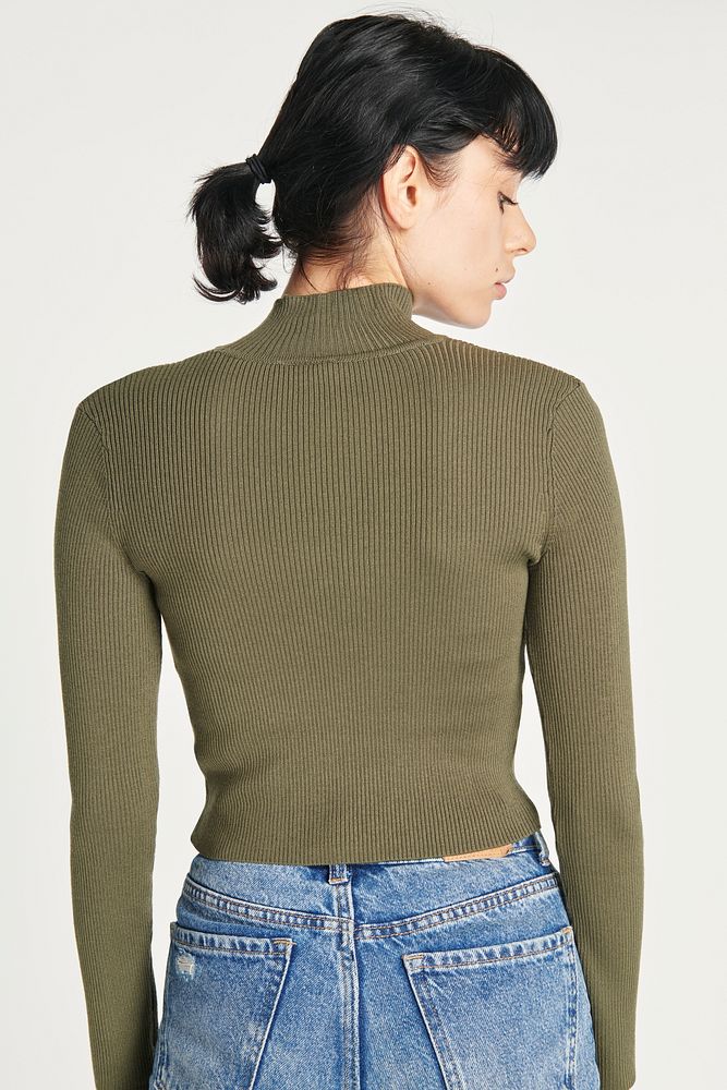 Green high neck top with high waisted blue jeans