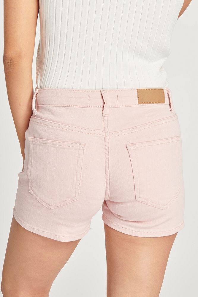 Women's white crop top and light pink short jeans mockup