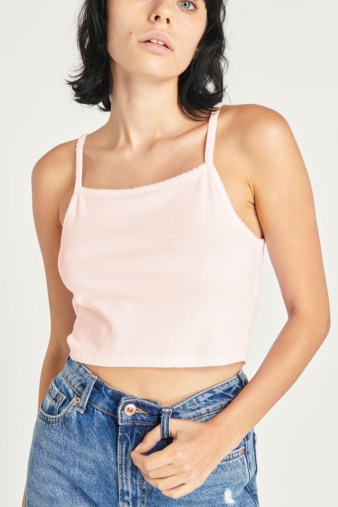 Woman in a baby pink cropped top 