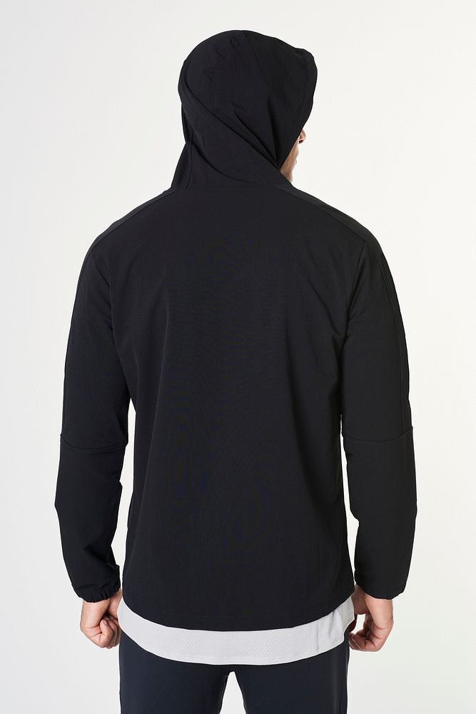 Man wearing a black hoodie over a t-shirt mockup