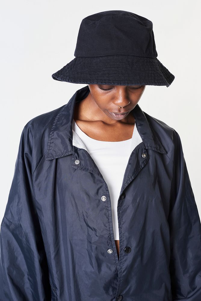 Black woman in a bucket hat wearing a navy blue jacket mockup