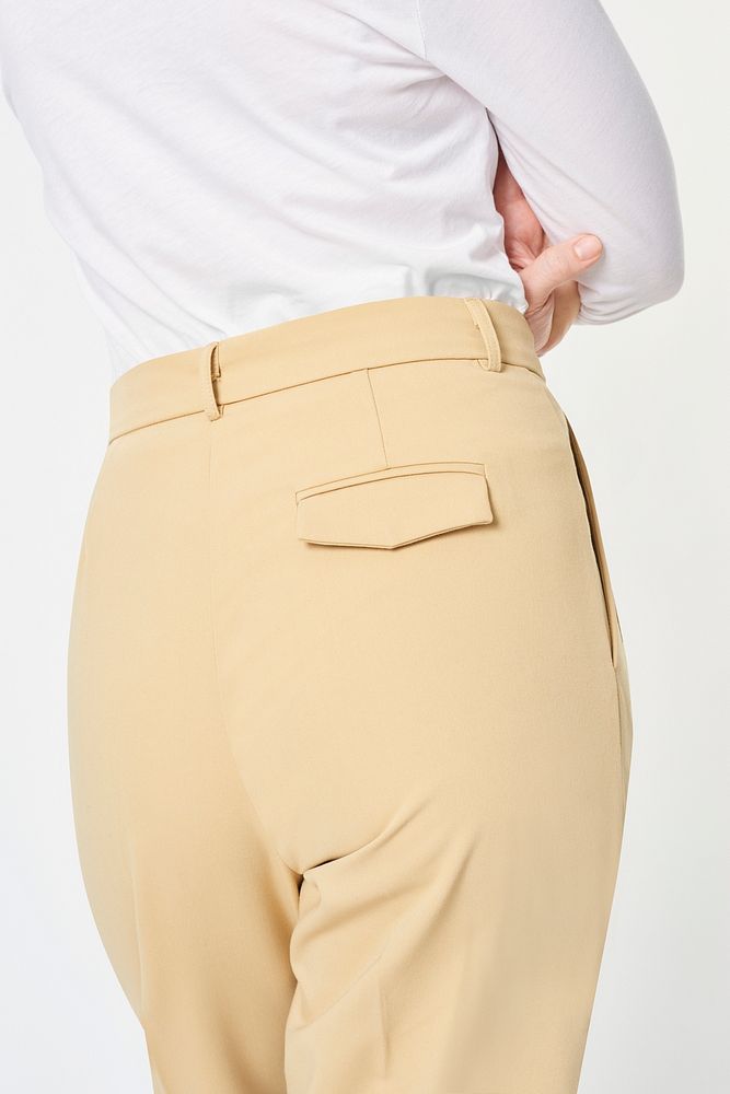 Woman wearing a white shirt and beige pants mockup