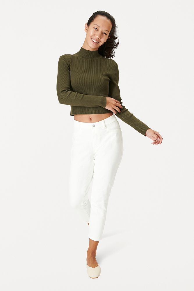 Women in a green turtleneck top with white pants
