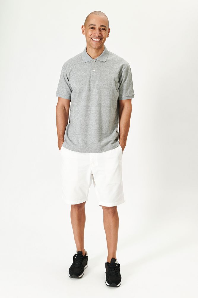 Man in a gray collared shirt and white shorts minimal outfit 