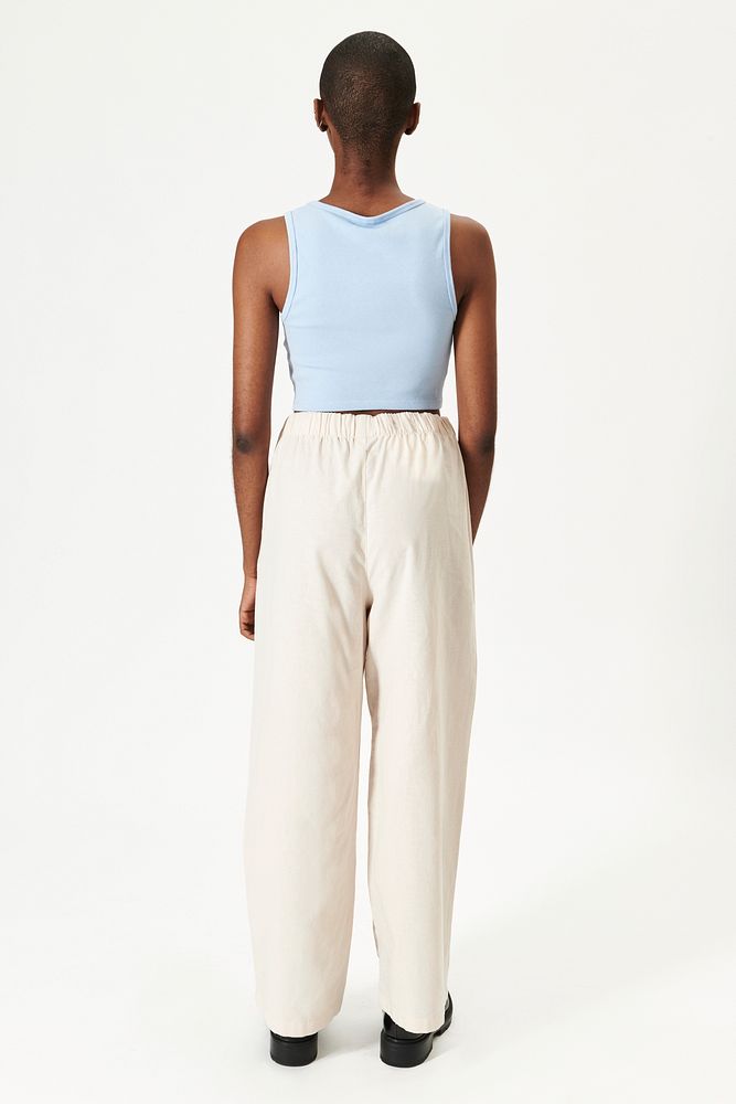 Black woman in a blue crop top and beige pants mockup