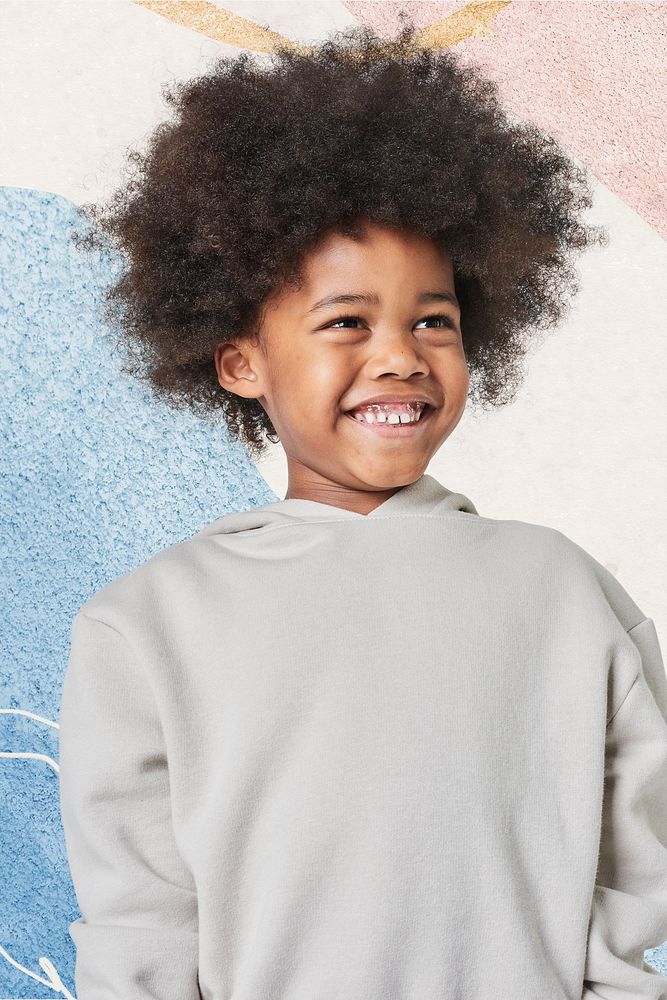 Black boy gray wearing sweatshirt in studio