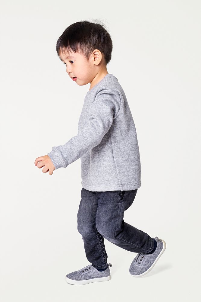 Boy's sweater with jeans and sneakers