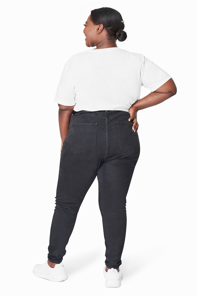 Plus size women's white tee and jeans fashion studio shot