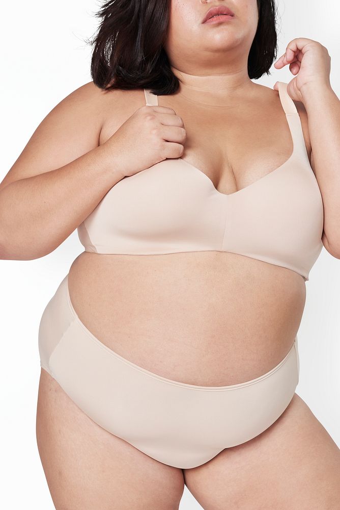 Body positivity beige lingerie plus size model posing