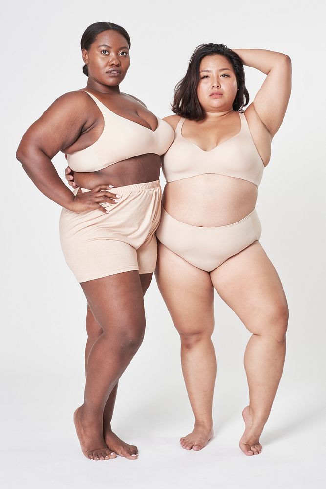 Attractive plus size model in beige women's lingerie