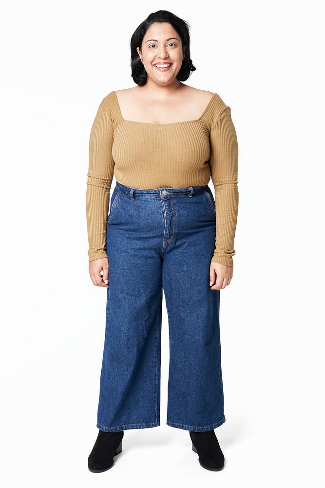 Women's brown top and jeans plus size fashion studio shot