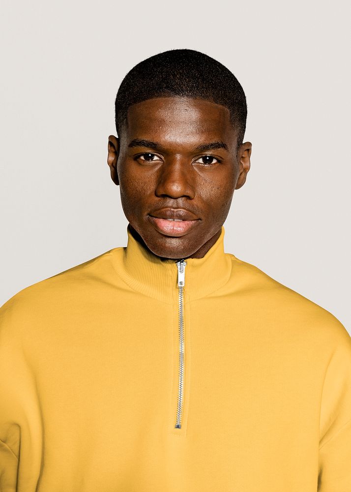 Black man in yellow zip up sweater portrait 
