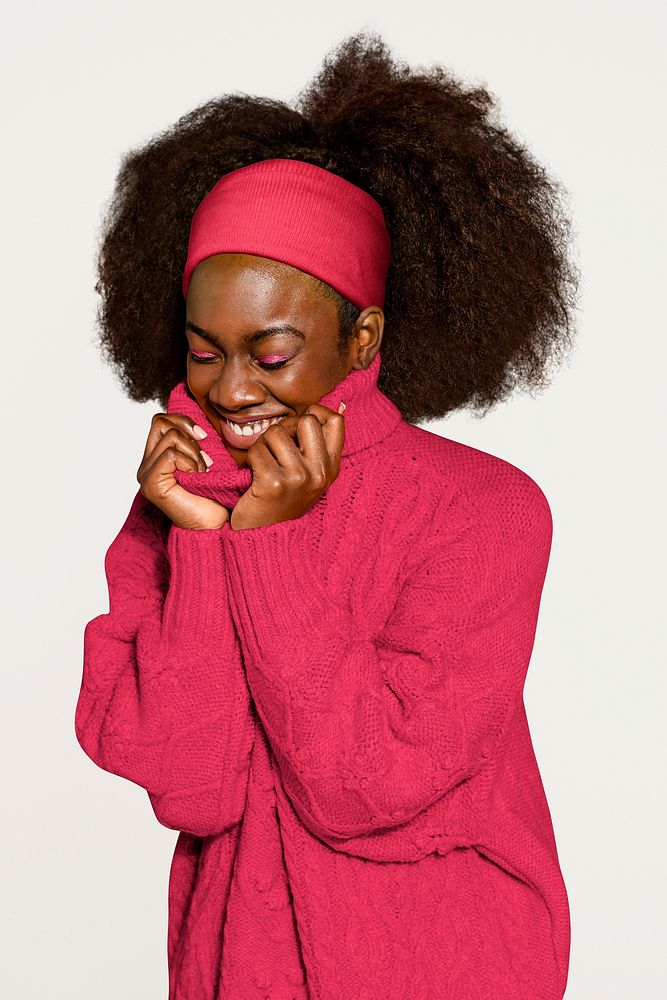 Cute woman in pink knitted sweater