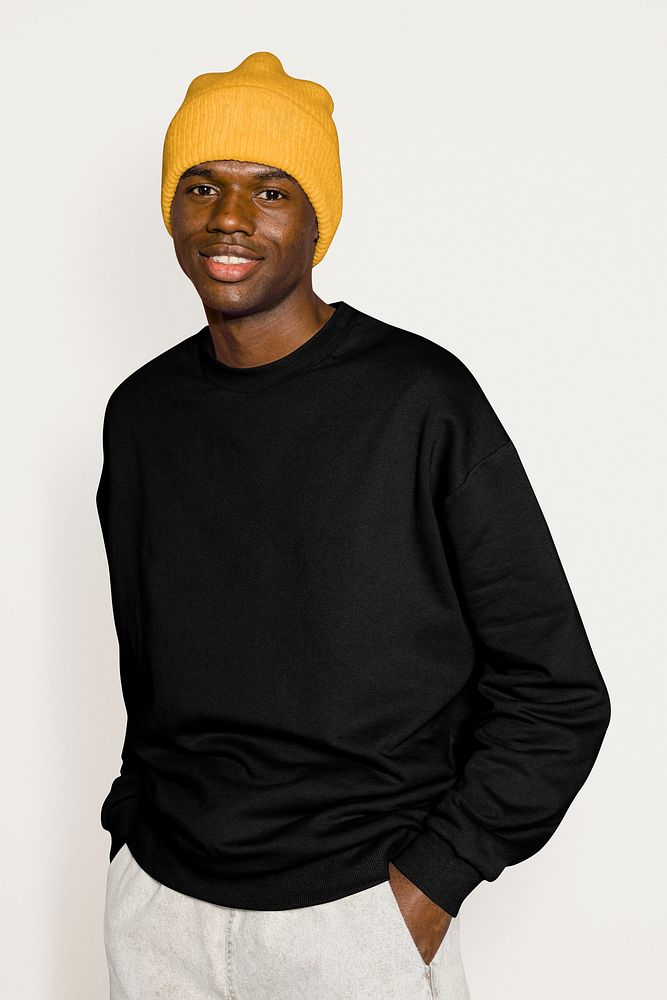 Black male model wearing yellow beanie 
