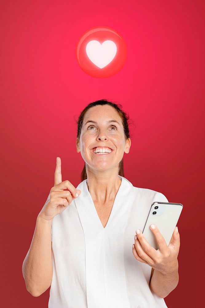 Woman using smartphone mockup psd with heart icon