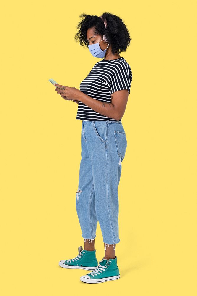 African woman texting mockup psd on her phone during the new normal