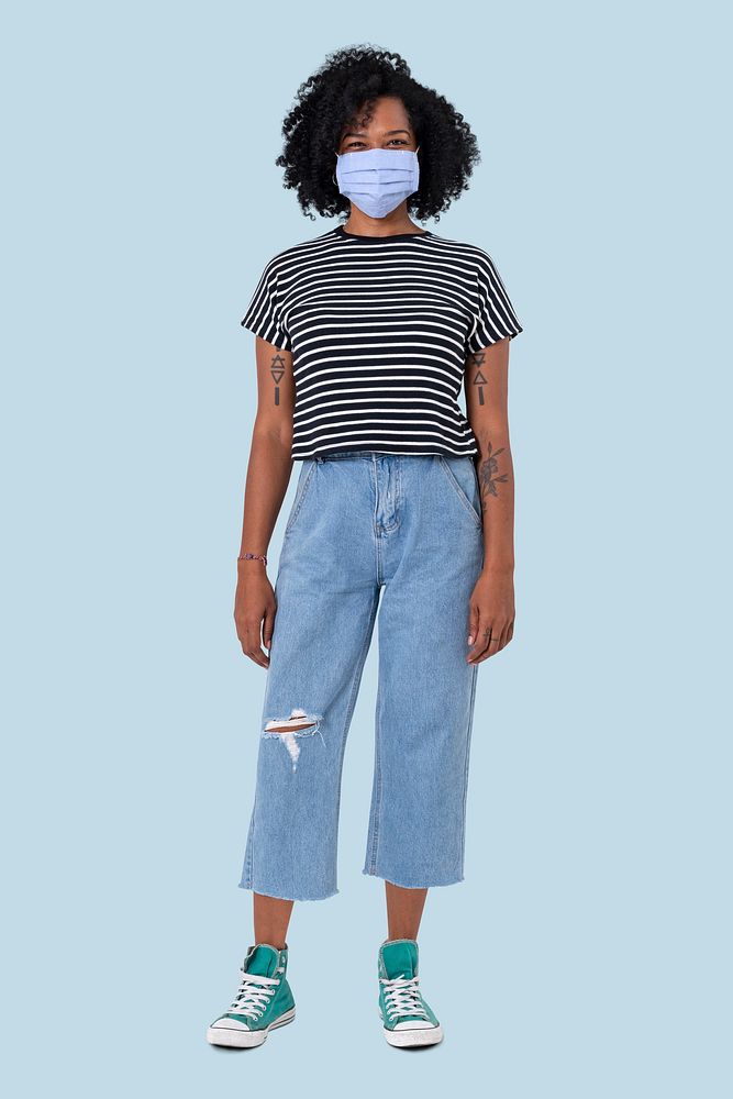 African woman wearing face mask in the new normal full body