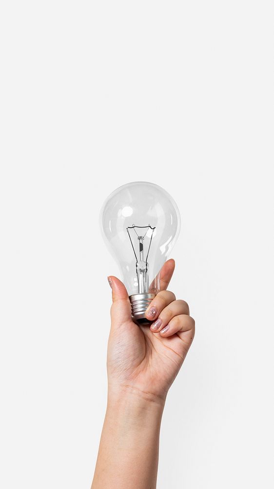 Light bulb creative business idea symbol held by a hand