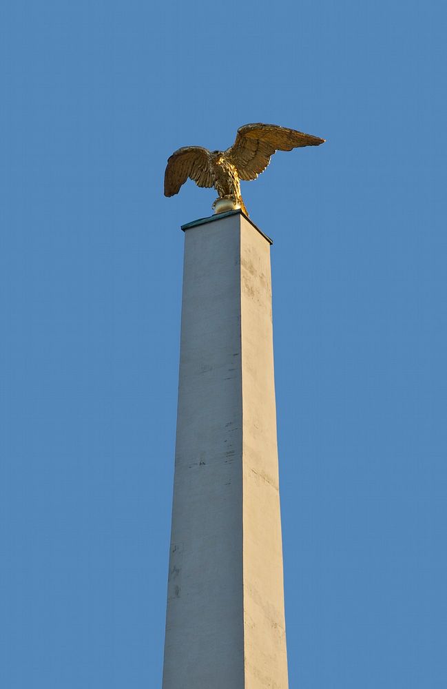 Gilded eagle on a column, main gate of the Schönbrunn castle, Vienna, Austria. Original public domain image from Wikimedia…