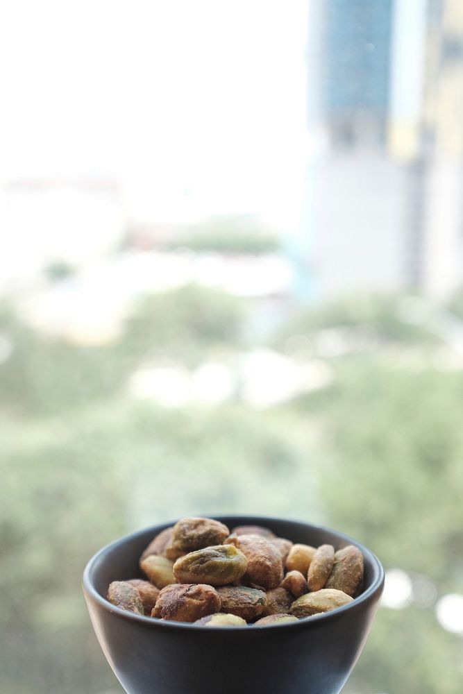 Small bowl of nuts and pistachios for snack. Original public domain image from Wikimedia Commons