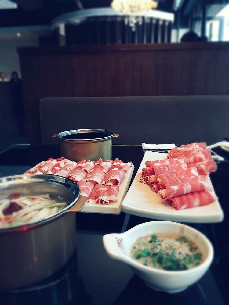 Rolls of raw meat and a bowl of soup at a hibachi restaurant. Original public domain image from Wikimedia Commons