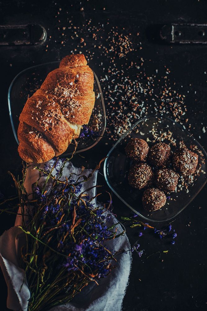 Rustic bakery tablescape with french croissant, chocolate truffles, and dried flowers. Original public domain image from…