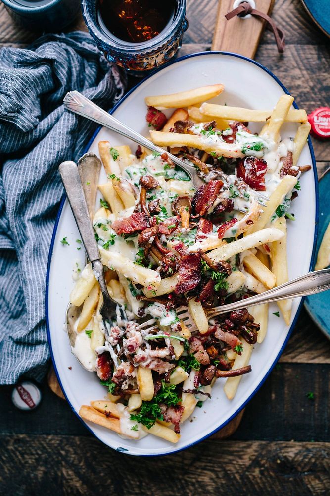 Loaded french fries with bacon, herbs, and cheese. Original public domain image from Wikimedia Commons