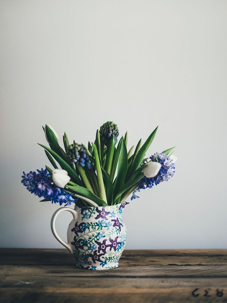 A floral vase with blue hyacinths and white tulips. Original public domain image from Wikimedia Commons