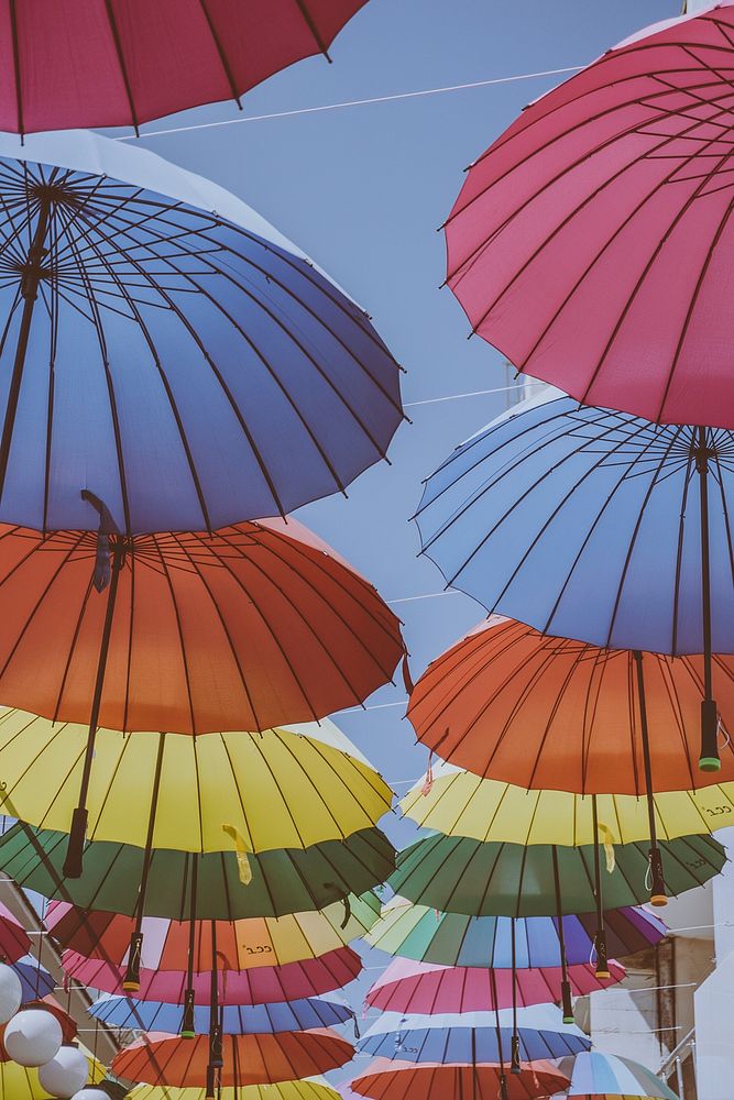 Colorful umbrellas hanging  in rows. Original public domain image from Wikimedia Commons