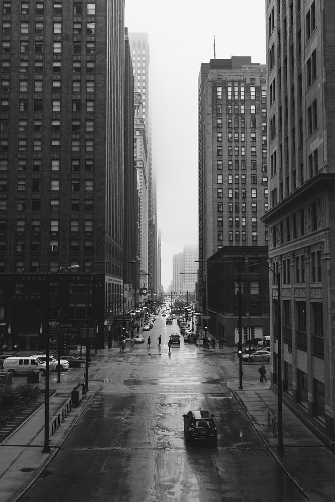 A black-and-white shot of the streets of Chicago on a rainy day. Original public domain image from Wikimedia Commons
