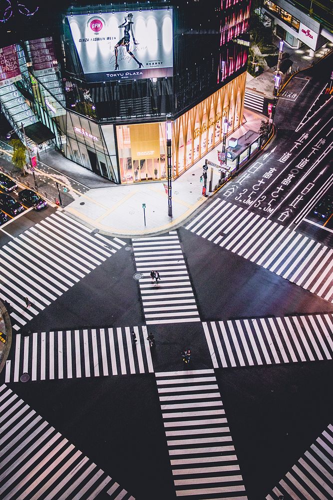 Intersecting crosswalk in Ginza, Tokyo at night. Original public domain image from Wikimedia Commons