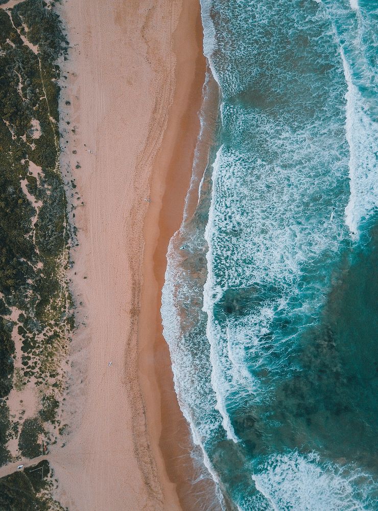 Drone aerial view of the ocean washing on the Mona Vale Beach. Original public domain image from Wikimedia Commons