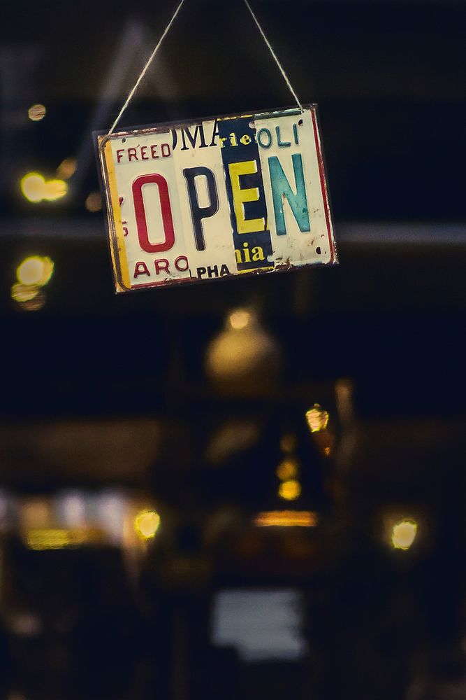 A colorful “open” sign made from license plates. Original public domain image from Wikimedia Commons