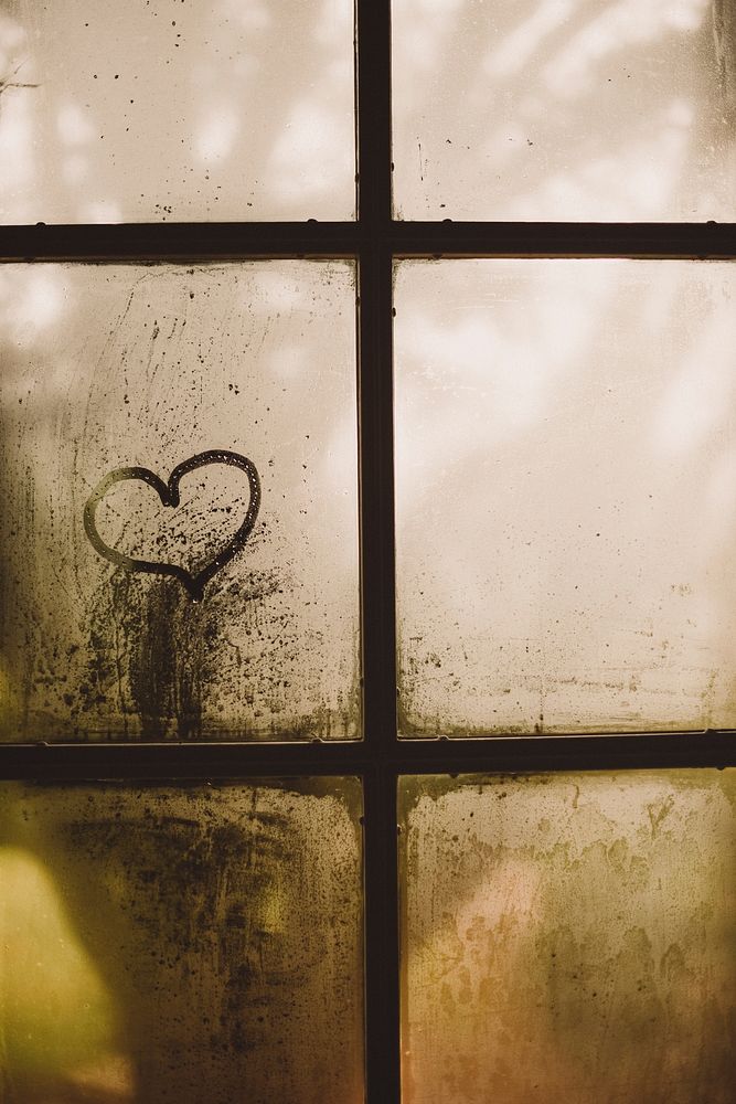 Someone has traced a heart with their finger onto this foggy window. Original public domain image from Wikimedia Commons