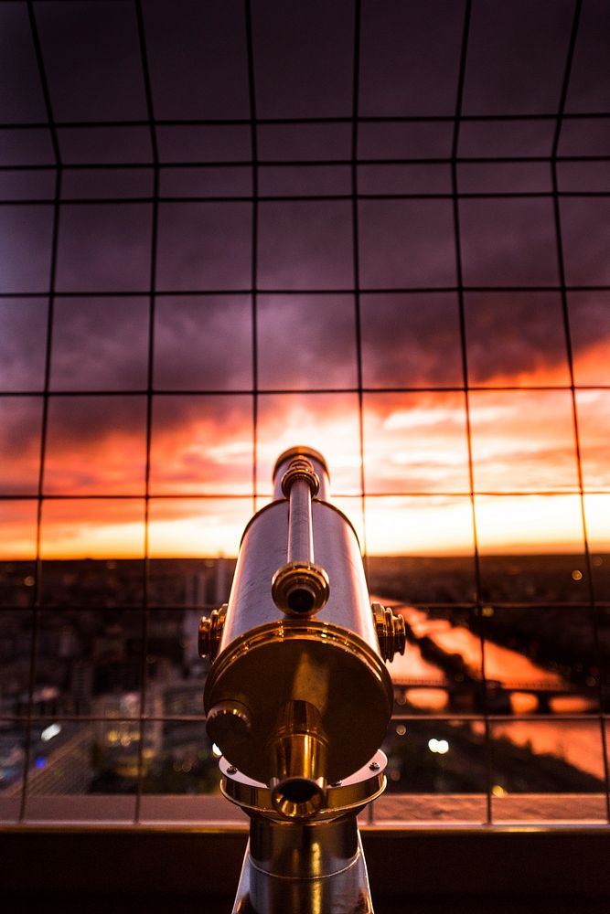 Looking at the sunset behind a telescope in Paris.. Original public domain image from Wikimedia Commons