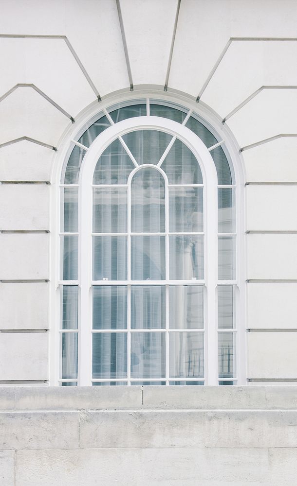 A white arched window in a building in London. Original public domain image from Wikimedia Commons