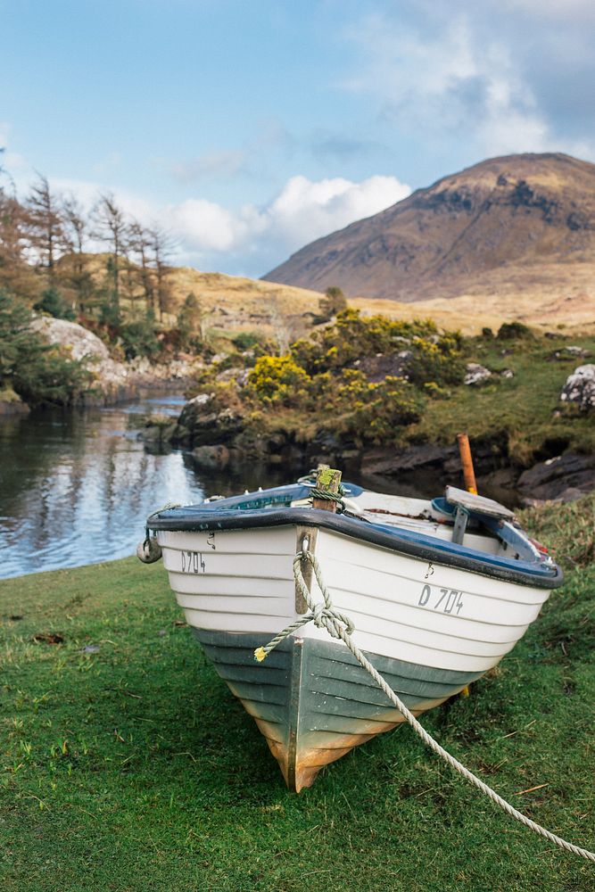 Boat by the mountain. Original public domain image from Wikimedia Commons