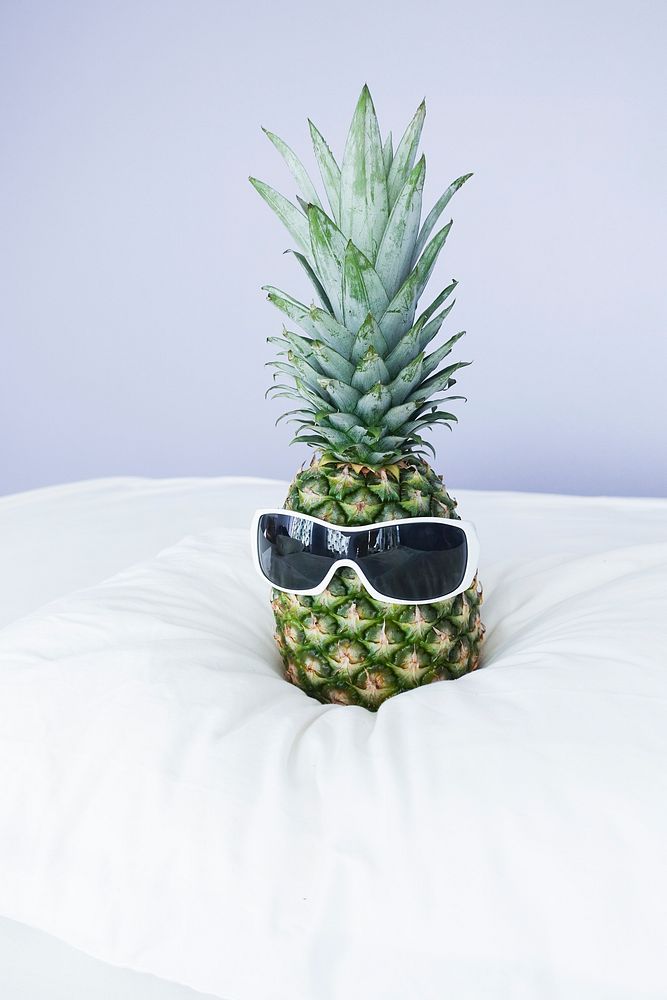 Cute summer pineapple wearing sunglasses. Original public domain image from Wikimedia Commons