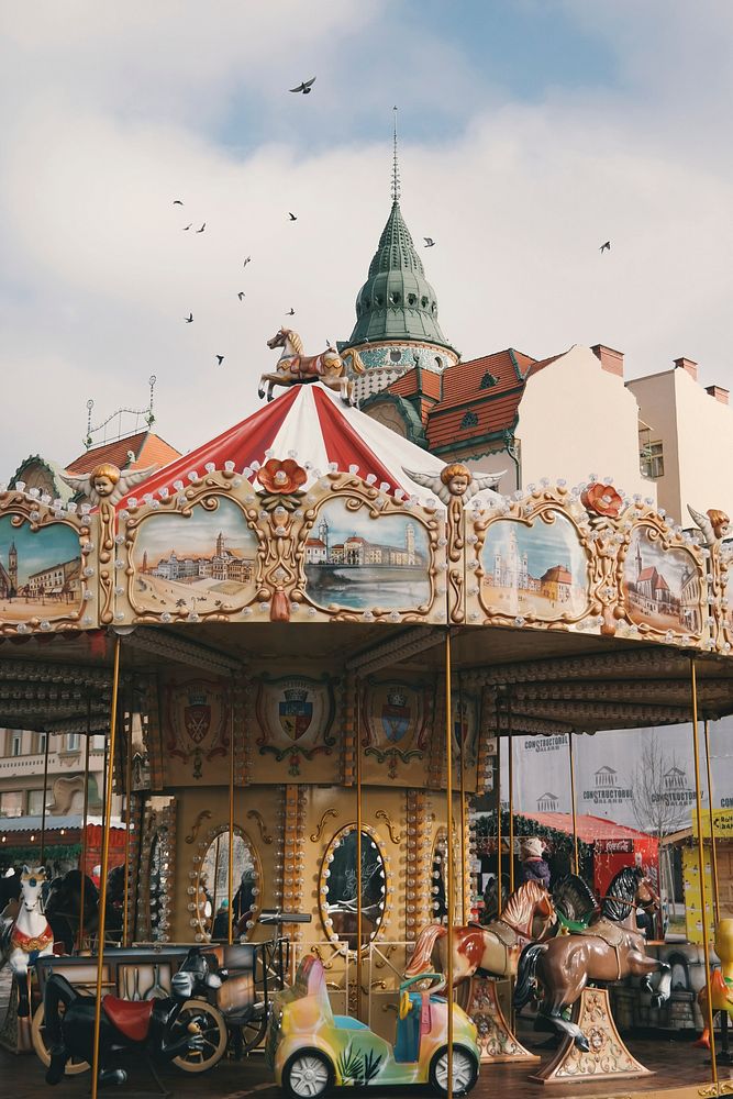 Merry go round at a carnival. Original public domain image from Wikimedia Commons