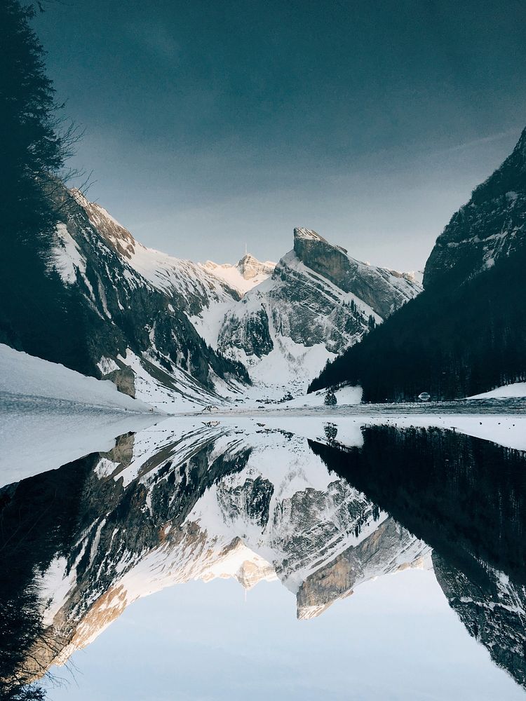 Snowy mountains and lake with reflection at Wasserauen, Appenzell Innerrhoden, Schweiz. Original public domain image from…