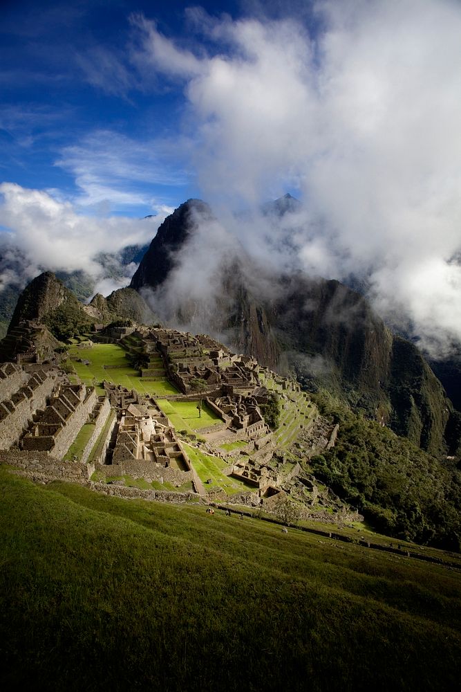 Cloudy day overlooking the ruins of Machu Picchu. Original public domain image from Wikimedia Commons