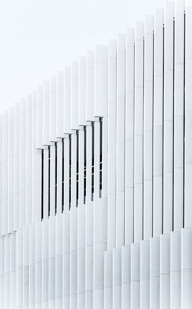 A white ribbed facade of a building in Lisbon. Original public domain image from Wikimedia Commons