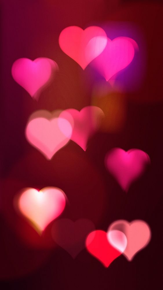 Pink heart bokeh iPhone wallpaper, glowing aesthetic pattern design
