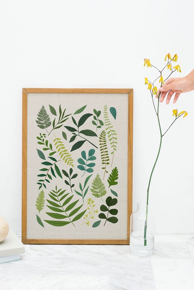 Wooden frame mockup by a yellow forsythia vase