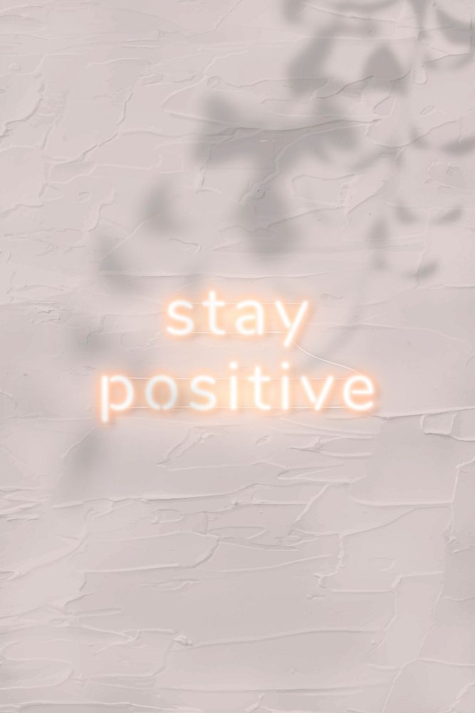 Stay positive neon word on concrete background