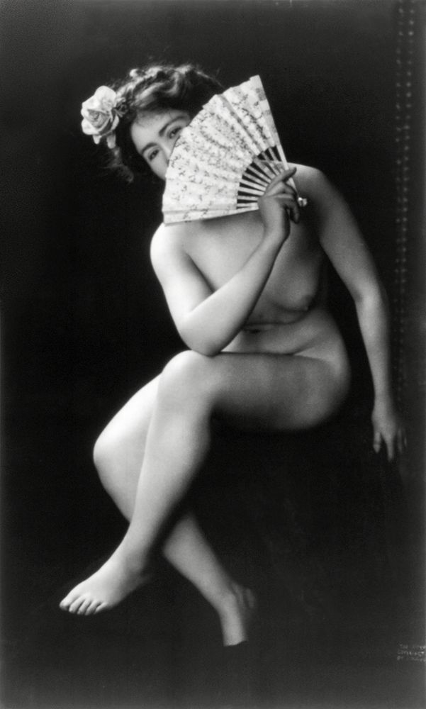 Nude woman with fan portrait photograph: The Coquette (ca. 1900) by J.M. Guerin. Original from Library of Congress.…