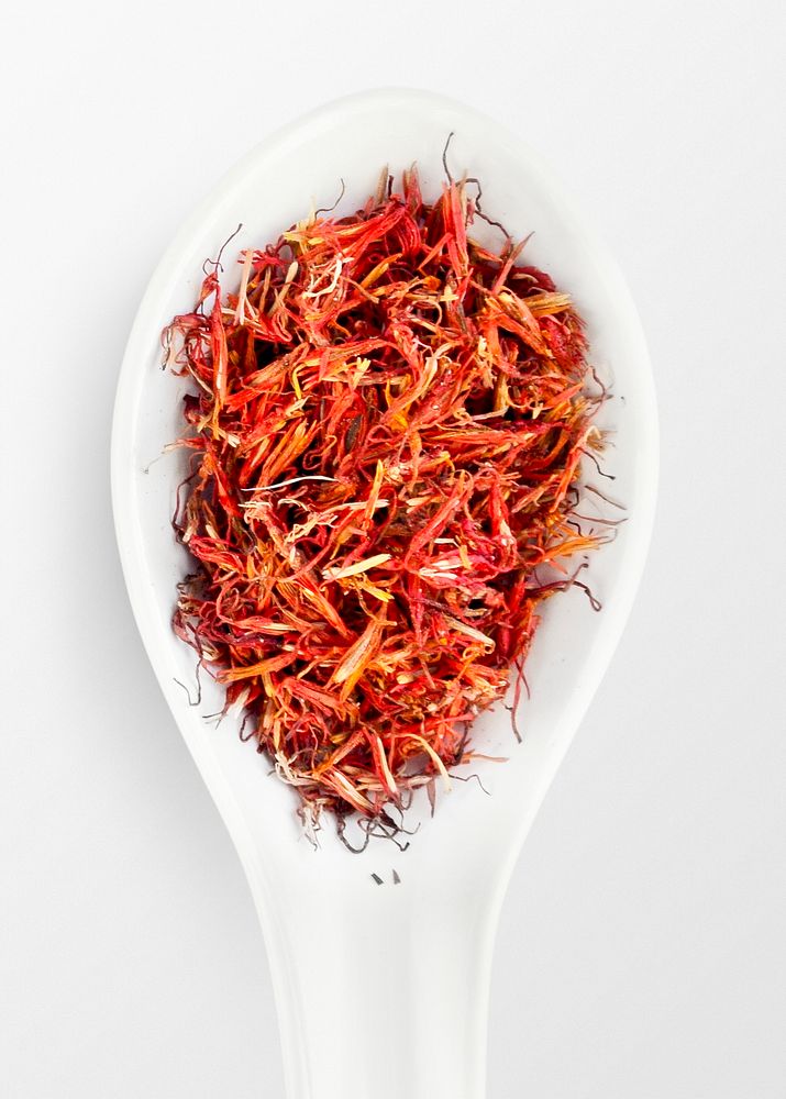 Spoon with red herbs, food photography