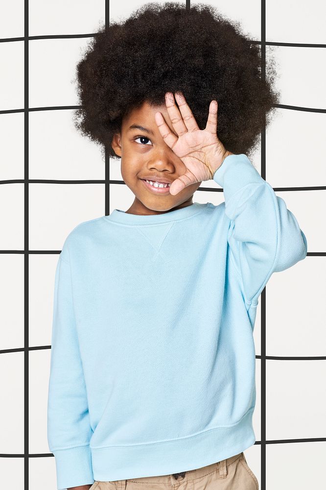 Black boy wearing blue sweater | Premium Photo - rawpixel